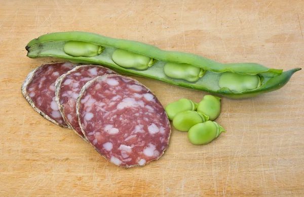 Salami slices and fava — Stock Photo, Image