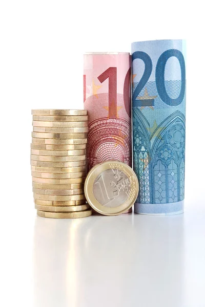 Rolled euro bills with coin — Stock Photo, Image