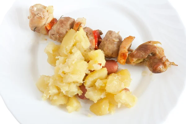 Dish with kebab and potatoes — Stock Photo, Image