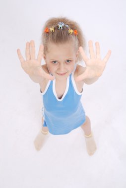 Girl shows five fingers. clipart