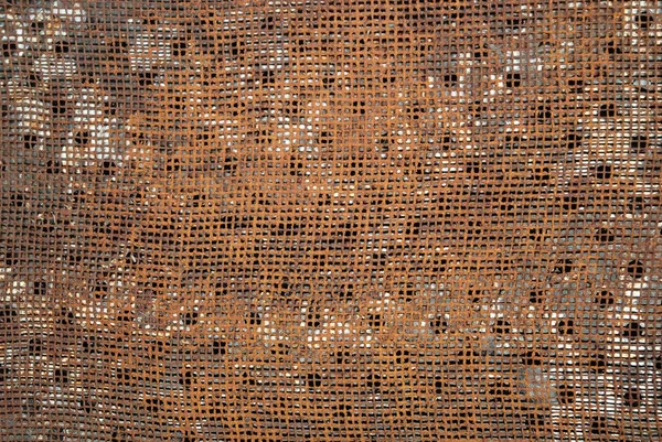Brown metal plate with holes — Stock Photo, Image