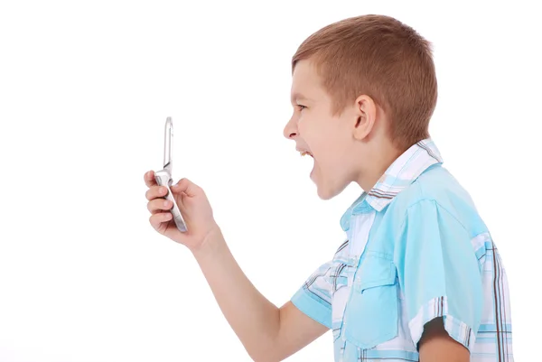 Boy is furiously screaming into his cell — Stock Photo, Image