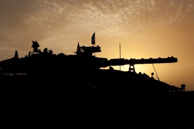 Tank silhouette at sunset clipart