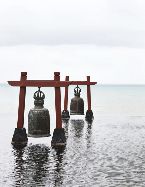 Two old large bells in water — Stock Photo, Image