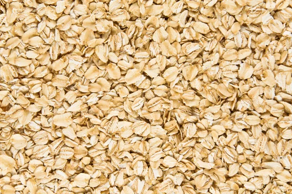 Background of raw oatmeal. — Stock Photo, Image