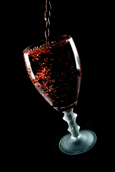 Glass of wine on a black background — Stock Photo, Image