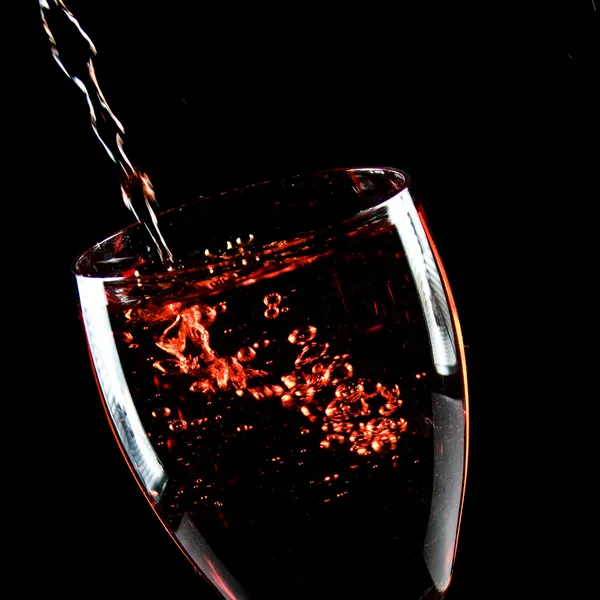 Bicchiere di vino su sfondo nero Fotografia Stock