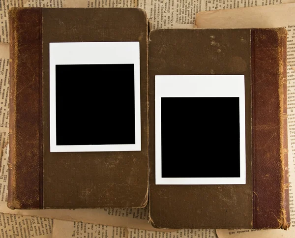 Photoframe from paloroid on a old books — Stock Photo, Image