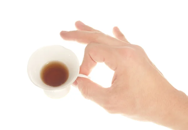 Man's hand with a cup of tea — Stock Photo, Image