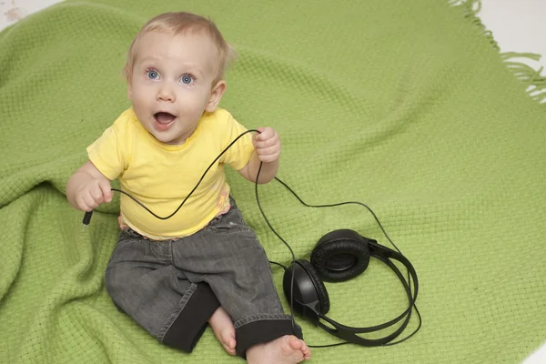Dziecko i słuchawki — Zdjęcie stockowe