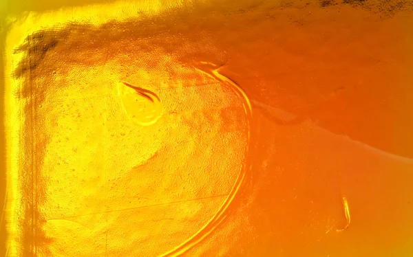 Surface of thick opaque orange glass — Stock Photo, Image