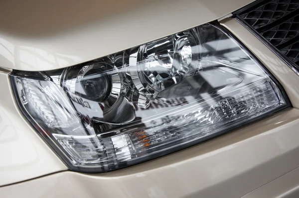 Headlight on a beige car — Stock Photo, Image