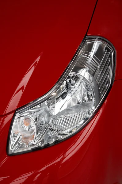 Headlight on a red car — Stock Photo, Image