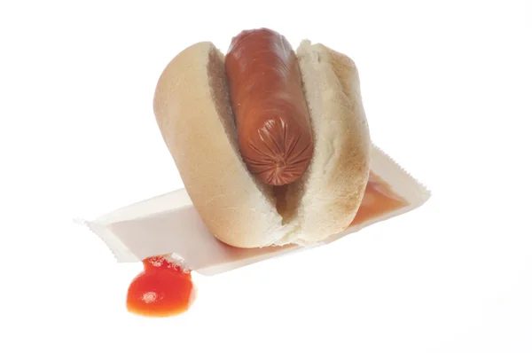 Perro caliente y paquete de salsa de tomate — Foto de Stock