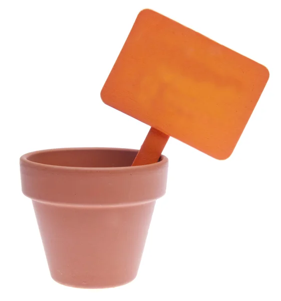 Pote de barro com sinal de laranja em branco — Fotografia de Stock