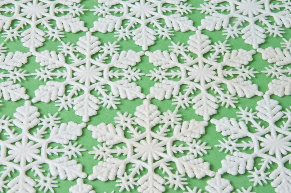 Snowflake Background on Green — Stock Photo, Image
