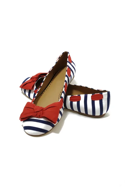 Zapatos rojos, blancos y azules Imagen de stock