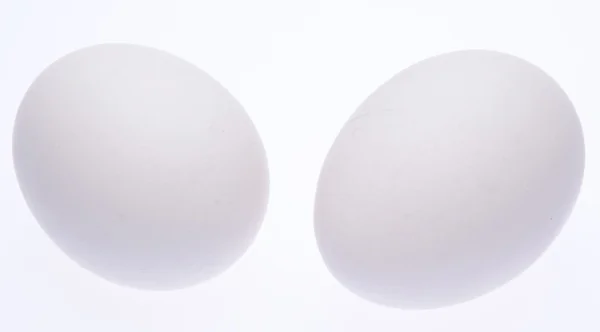 Par friske æg på hvid - Stock-foto