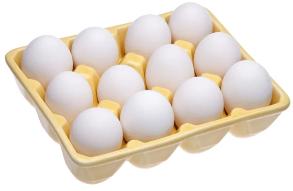 Dutzende Eier in gelbem offenen Karton — Stockfoto