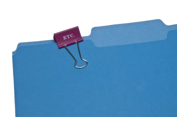 Clipe de papel ETC na pasta de arquivo azul . — Fotografia de Stock