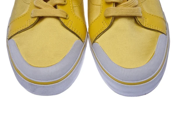 Rubber tenen op gele schoenen — Stockfoto