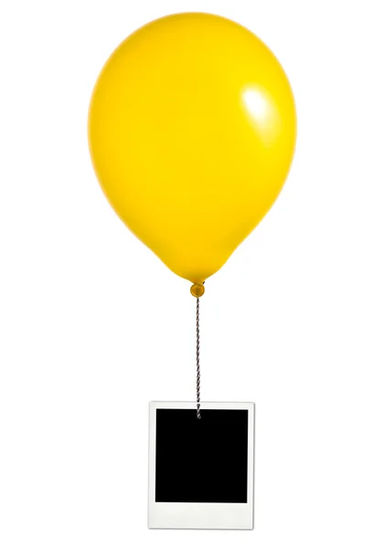 Yellow balloon and photo frame — Stock Photo, Image