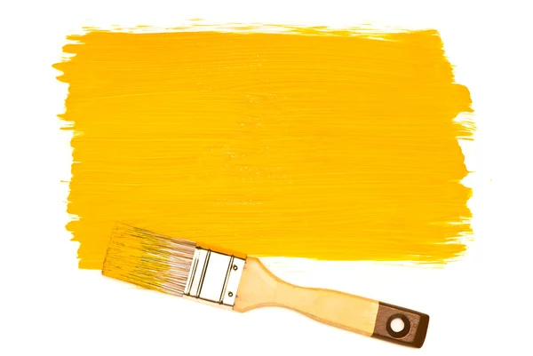 Tinta e pincel amarelo — Fotografia de Stock