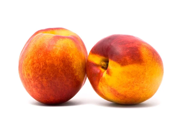 Dwie soczyste nektarynki — Zdjęcie stockowe