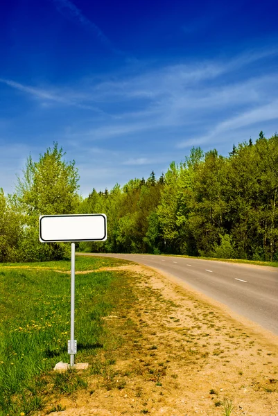 Clear sign in beautiful forest road — Stock Photo, Image