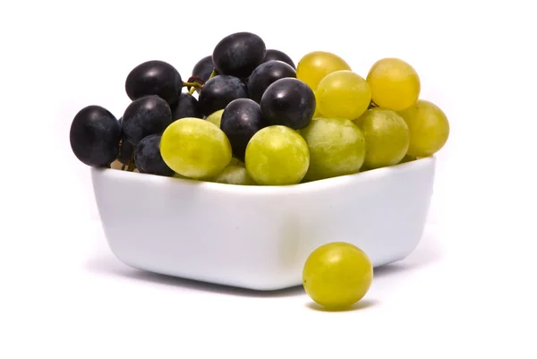 Зеленый и синий виноград — стоковое фото