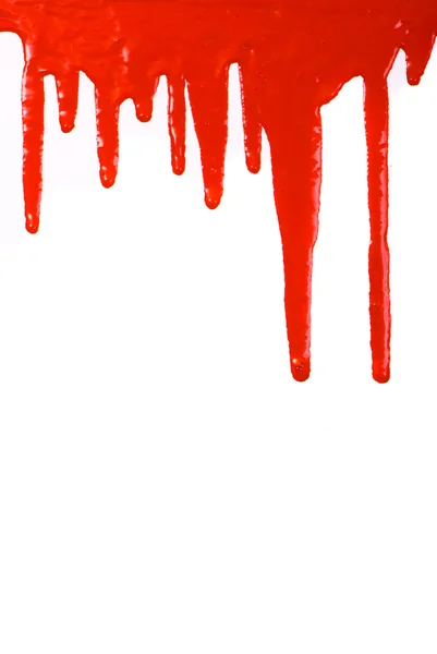 Vernice rossa versando su sfondo bianco — Foto Stock