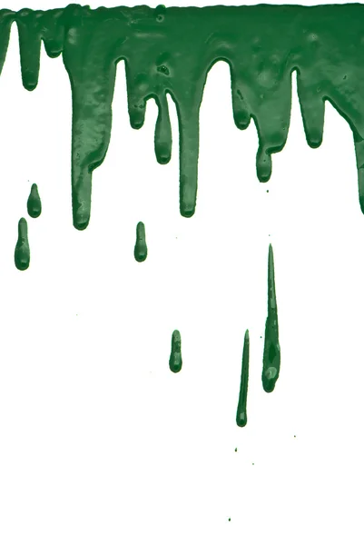 Zielona farba wylewa się na białe tło — Zdjęcie stockowe