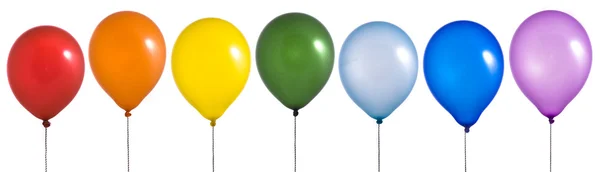 Regenbogen-Luftballons auf weißem Hintergrund Stockbild