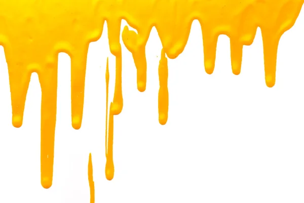 Yellow paint pouring on white background — Stock Photo, Image