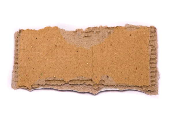 Разорванный кусок картона — стоковое фото
