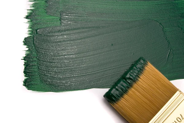 Brush with green paint — Stock Photo, Image