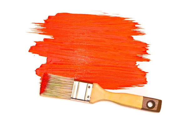 Red paint and brush on white studio — Stock Photo, Image