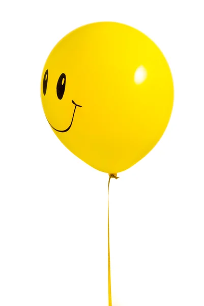 Sárga léggömb mosollyal, fehér — Stock Fotó