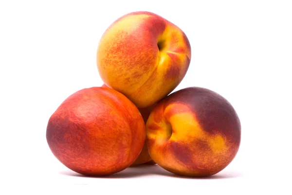 Juicy nectarines on a white background — Stock Photo, Image