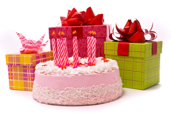 Pink pie with nine candles and gifts — Stock Photo, Image