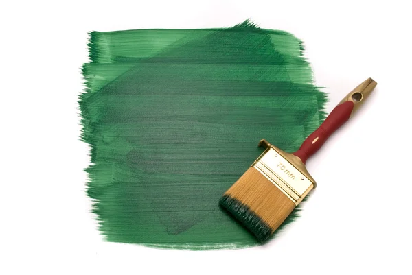 Escova com tinta verde no branco — Fotografia de Stock