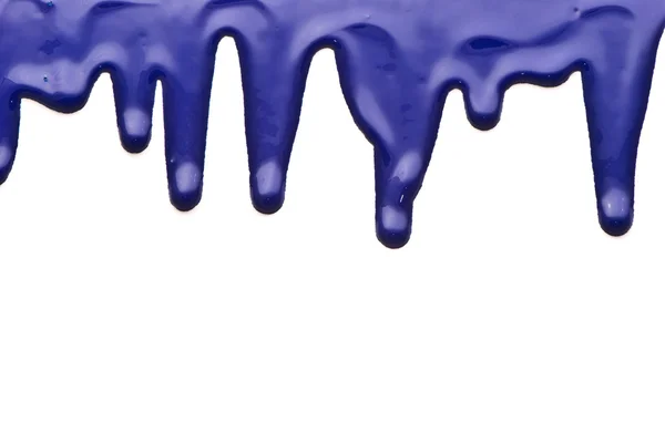 Vernice blu versando su sfondo bianco — Foto Stock