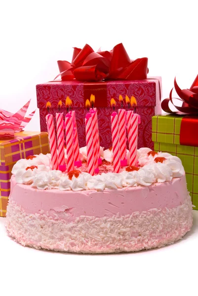 Pink pie with eleven candles and gifts — Stock Photo, Image