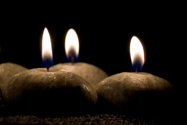 Τρία κεριά με τη μορφή πέτρες — Φωτογραφία Αρχείου
