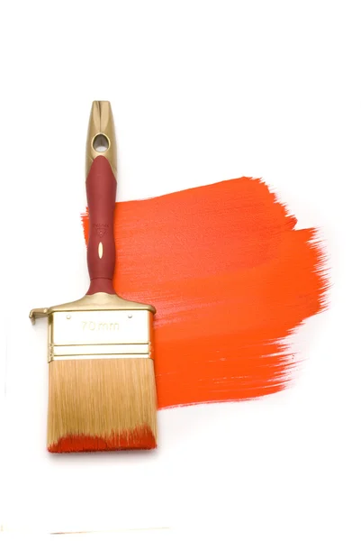 Brush with red paint on the white — Stock Photo, Image
