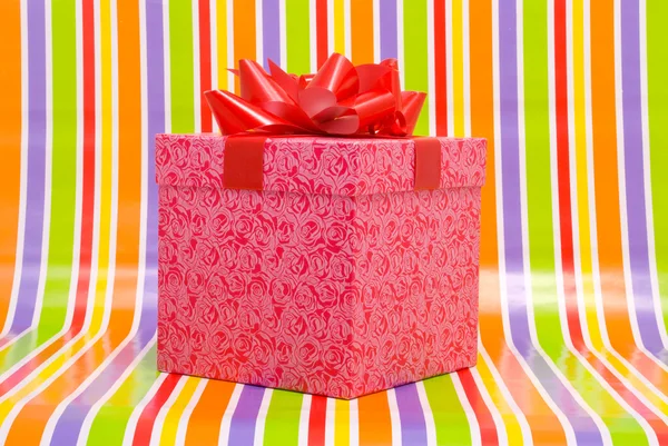 Gift box on a stripe background — Stock Photo, Image