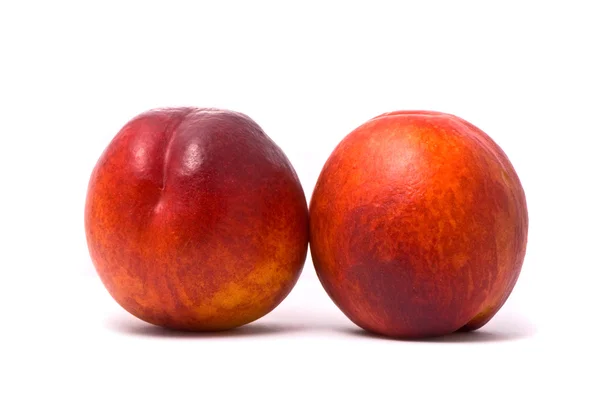 Dwie soczyste nektarynki — Zdjęcie stockowe