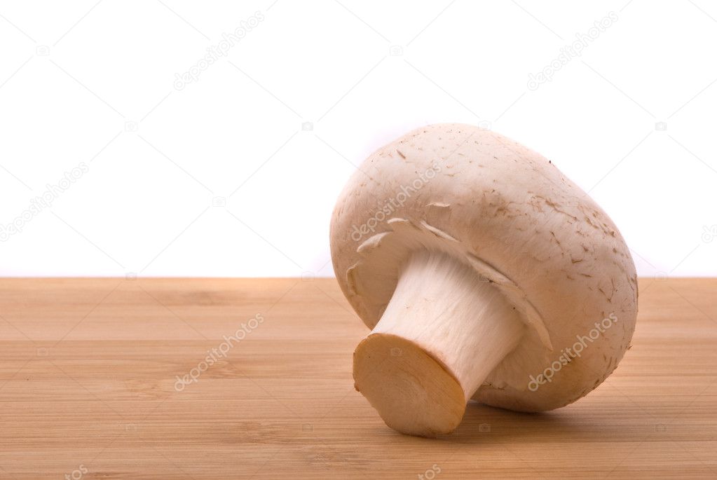 Fresh mushroom on a chopping board