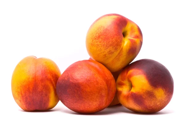 Juicy nectarines on a white background — Stock Photo, Image
