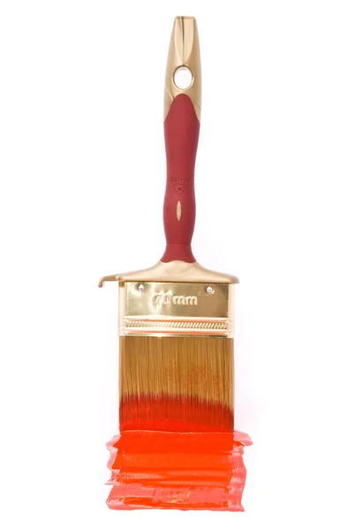 Brush with red paint on the white — Stock Photo, Image